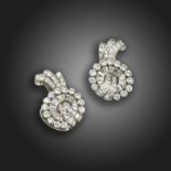 A pair of diamond scroll earrings, c.1940, set with graduated baguette-shaped and circular-cut