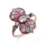 A ruby and diamond cluster ring, the navette-shaped cluster centred with an old circular-cut