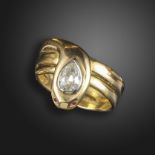 A diamond-set gold snake ring, set with an old pear-shaped diamond weighing approximately 0.35cts,