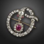 A George III diamond snake brooch pendant, the knotted serpent set with graduated old cushion-shaped