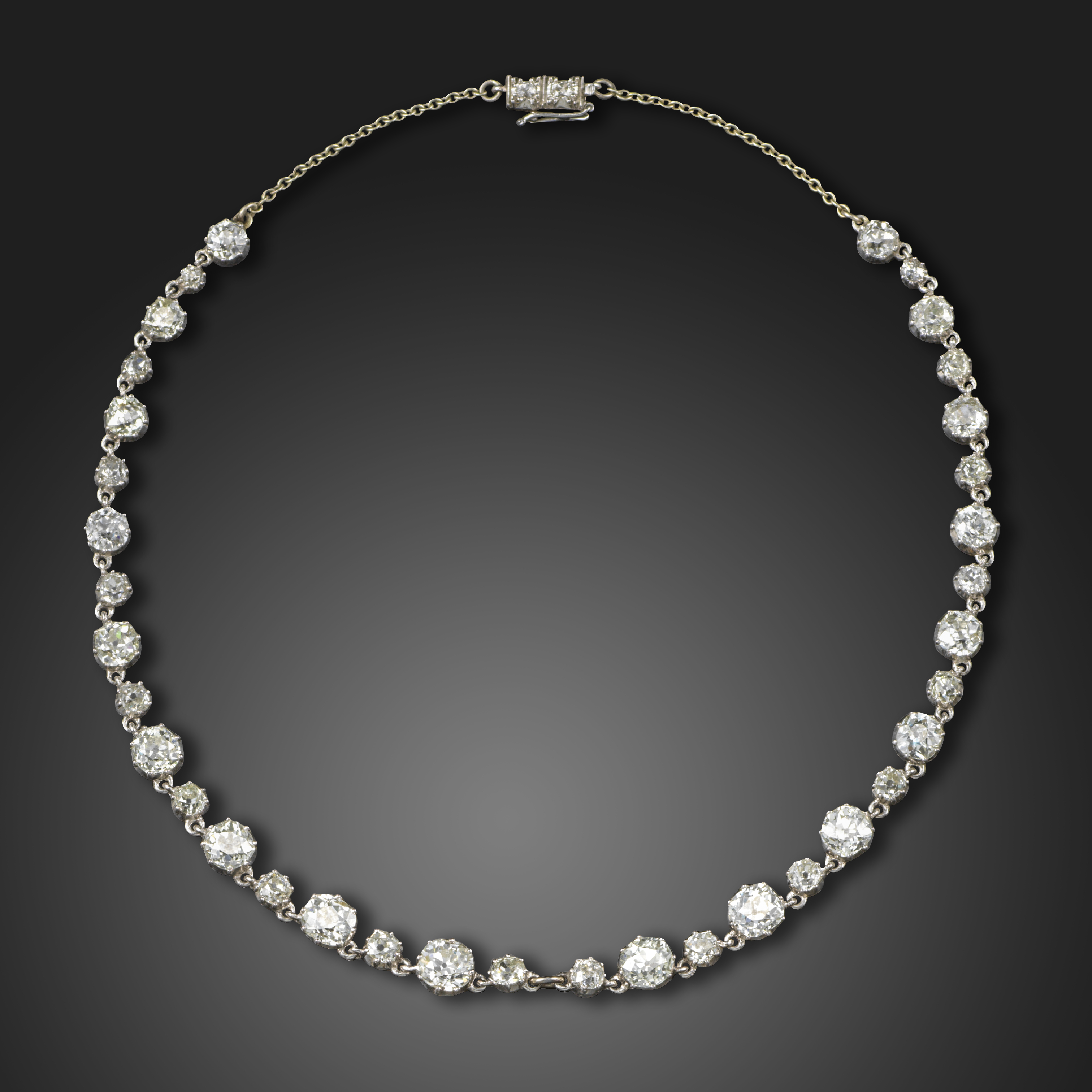 An early 20th century diamond choker necklace, set with graduated old circular-cut diamonds, with