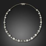 An early 20th century diamond choker necklace, set with graduated old circular-cut diamonds, with