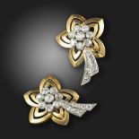 A pair of diamond shooting star earrings, centred with a cluster of old circular-cut diamonds,