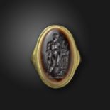 A late 18th century sardonyx intaglio depicting Meleager, with his hunting dog and a boar's head