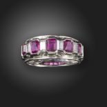 A ruby and diamond half-hoop ring, alternately channel-set with rectangular-shaped rubies and