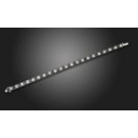 A diamond and black onyx line bracelet, alternately-set with French-cut diamonds and black onyx