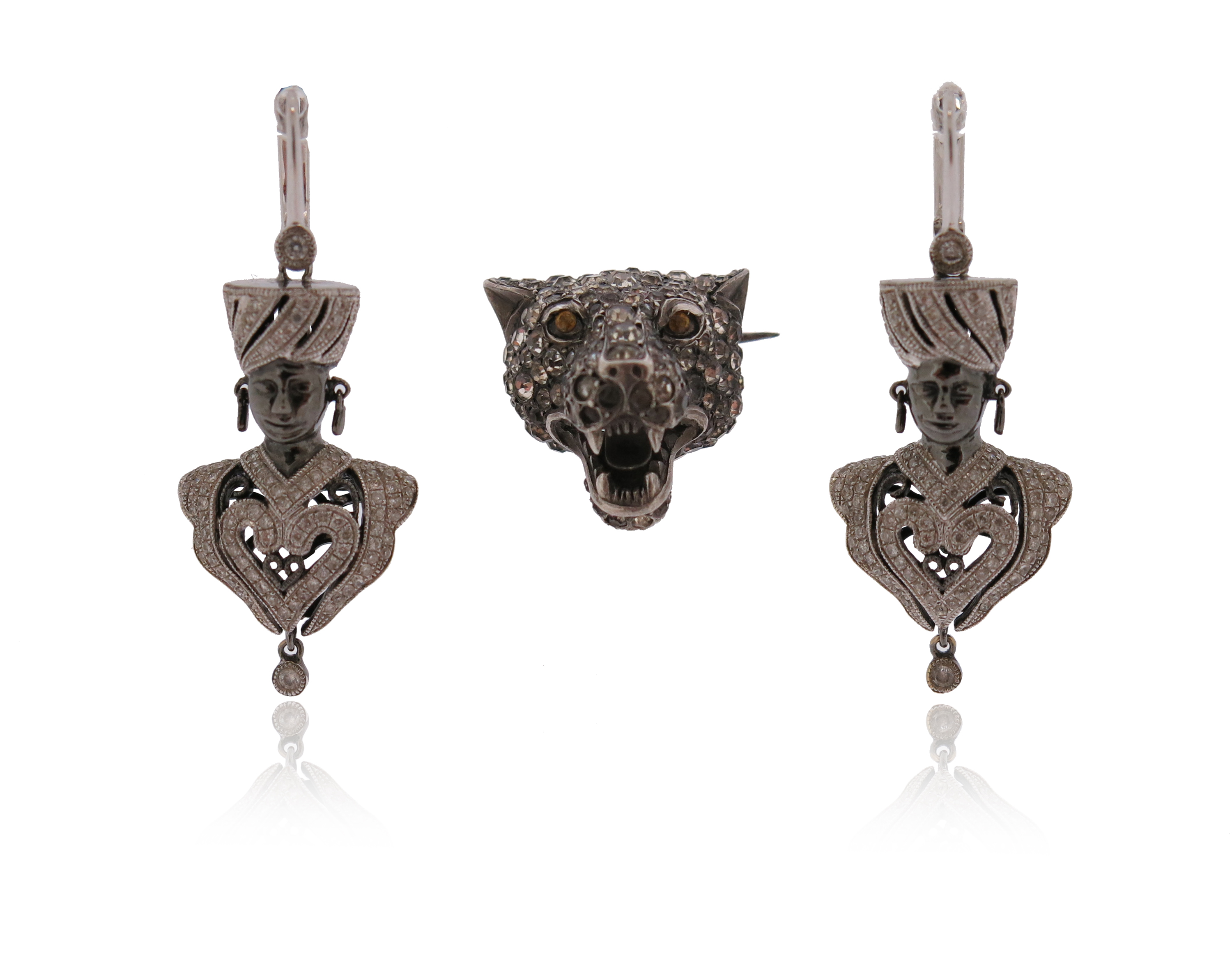 A pair of diamond-set gold blackamoor earrings, set in white gold, 4cm high (including fitting),