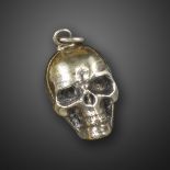 A 19th century memento mori silver skull pomander, realistically formed with hinged compartment