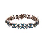 A French late 19th century diamond and turquoise-set bracelet, the scroll-form links set with
