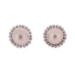 A pair of mabι pearl and diamond earrings, the mabι pearls set within a cluster of round brilliant-