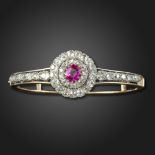 A late Victorian pink sapphire and diamond convertible bangle, the cushion-shaped pink sapphire