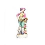 A Derby figure of the Garland Shepherd c.1760-65, leaning on a tree stump applied with flowers and