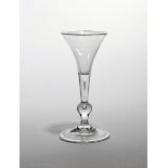 A balustroid wine glass of 'Kit Kat' type c.1740, the drawn trumpet bowl rising from a plain stem