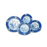 Four Lambeth delftware dishes c.1740-50, probably William Griffith, two plates in different sizes,
