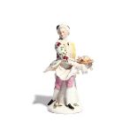 A rare Bow figure of the Poultry Chef c.1755, wearing a floral-patterned coat over pink breeches,