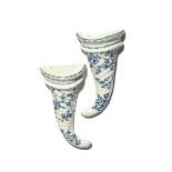 A good pair of Worcester blue and white wall pockets c.1755-58, of spiral-moulded cornucopia form,