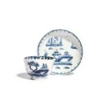 A Lowestoft miniature or toy blue and white teabowl and saucer c.1765-70, painted with boats in an