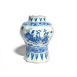 A Delft vase c.1660-80, of baluster form raised on an octagonal foot, painted with Chinese figures