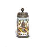 A German faïence tankard dated 1789, the cylindrical form brightly enamelled with a figure in Middle