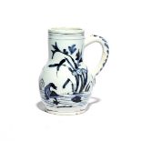 A small Delft mug or tankard c.1680, the baluster form painted in a dark blue with ducks swimming