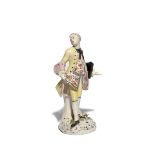 A rare Bow figure of the Squire of Alsatia c.1760, standing with one foot turned out, his right hand