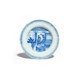 A good delftware plate c.1760, painted in underglaze blue with a Chinese lady seated in an