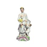 A Longton Hall figure of Ceres c.1755, emblematic of Summer, standing with a putto, holding a