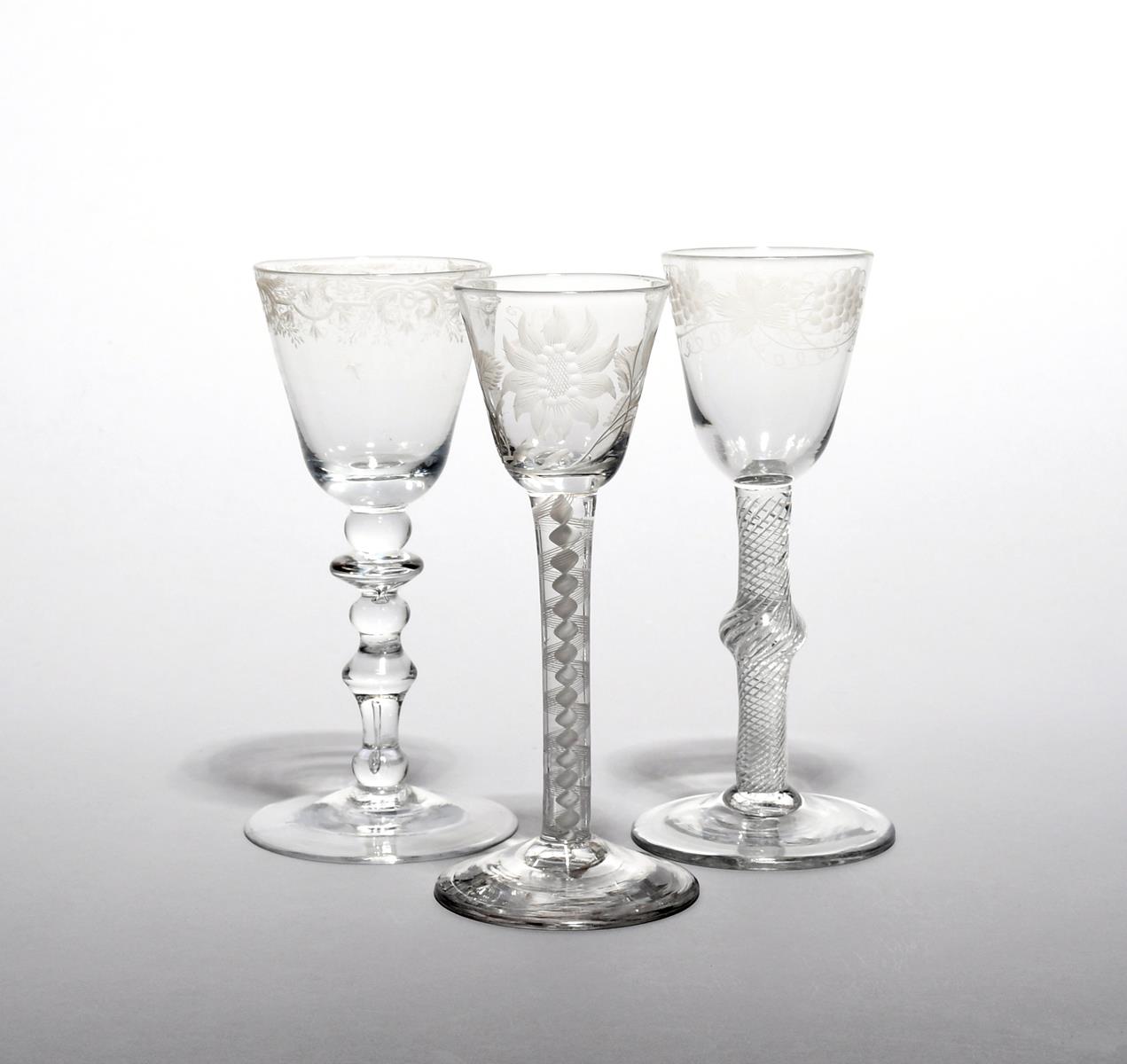 Three small wine glasses mid 18th century, one of possible Jacobite relevance, with a round funnel