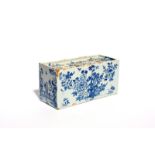 A large delftware flower brick c.1750-60, one long side painted with a pagoda landscape, the reverse