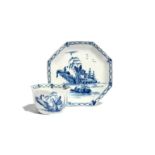 A Worcester blue and white octagonal teabowl and saucer c.1756, painted with the Romantic Rocks