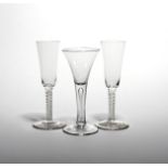 A pair of large wine fluted or ale glasses c.1760, the tall slender bowls raising from double series