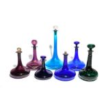 Seven coloured glass ship's decanters and stoppers 19th century, three Bristol blue with one