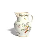 A Bristol mask jug c.1770-72, finely painted with sprays of flowers in a muted polychrome palette,