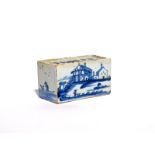 A small delftware flower brick c.1750, the rectangular form painted to one side with a figure