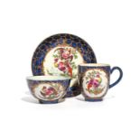 A Worcester trio c.1765, comprising a coffee cup, teabowl and saucer, painted with colourful fancy