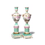 A pair of KPM (Berlin) cassolettes 19th century, the urn forms painted with scenes of courting