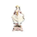 A Bow figure of a dancer c.1760, after a Meissen model of Columbine, standing on a footed base