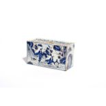 A delftware flower brick c.1730-40, the large rectangular form painted in blue and manganese with