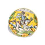A Montelupo maiolica equestrian charger late 17th century, painted with a soldier brandishing a