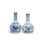 Two delftware bottles or guglets c.1760, probably Liverpool, decorated in blue with bold flowering