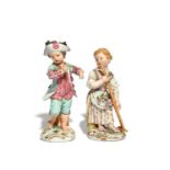 A pair of Meissen figures of children gardeners late 18th century, modelled as a boy wearing a hat