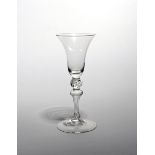 A Newcastle light baluster glass mid 18th century, with a bell bowl raised on a slender baluster