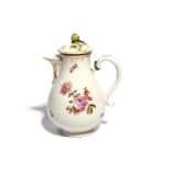 A Vienna hot water jug and cover c.1775, painted with polychrome flower sprays and small scattered