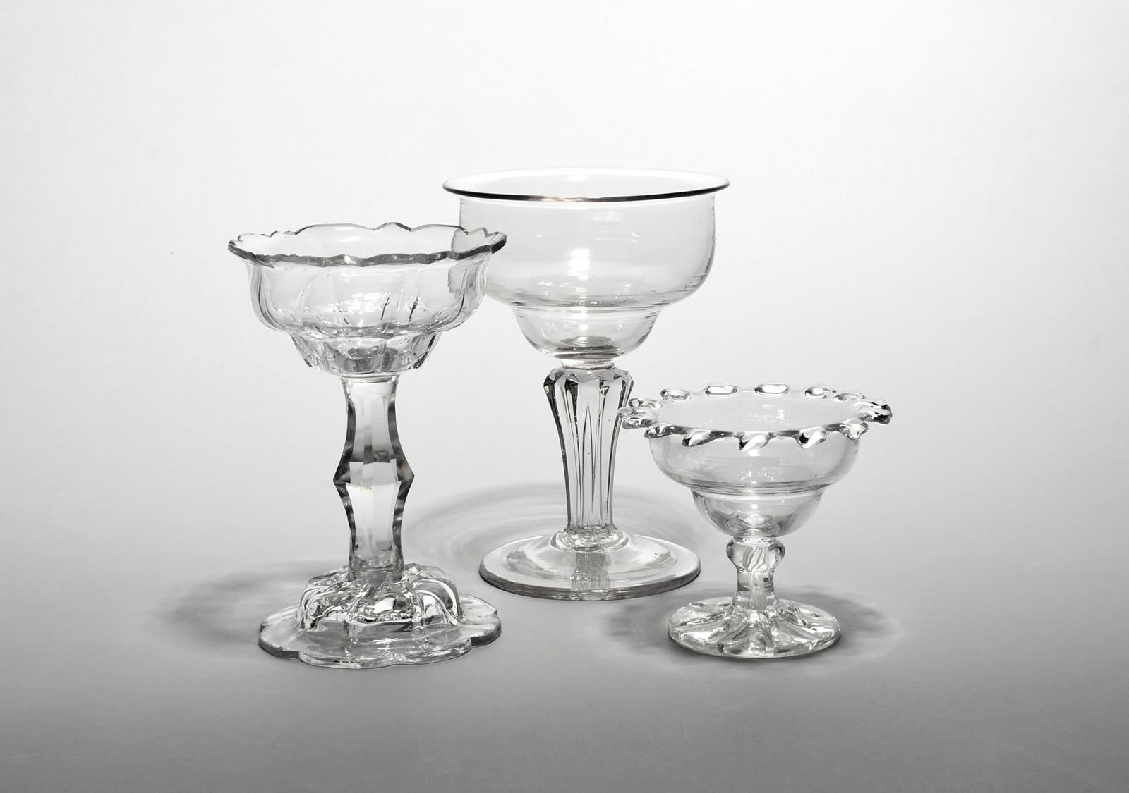 Three sweetmeat glasses c.1770 and later, the smallest with an ogee bowl with pinched rim above a