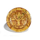 A massive West Country slipware charger 19th century, decorated in cream slip with Charles II