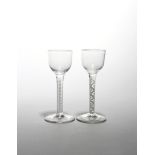 Two wine glasses c.1760-70, with small rounded funnel bowls raised on double series opaque twist