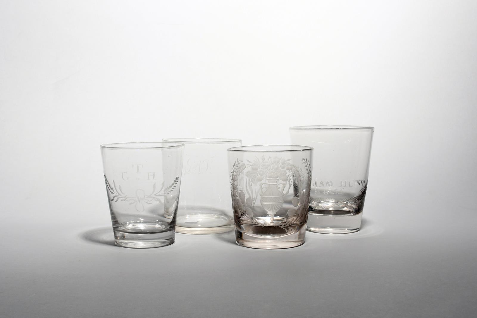 Four glass tumblers or beakers 19th century, of flared cylindrical form, one engraved for William