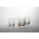 Four glass tumblers or beakers 19th century, of flared cylindrical form, one engraved for William