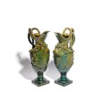 A pair of large glazed stoneware ewers 19th century, probably French, after a design by Clodion,