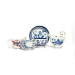 A Lowestoft blue and white teabowl and saucer c.1780, painted with a Chinese pagoda landscape, a